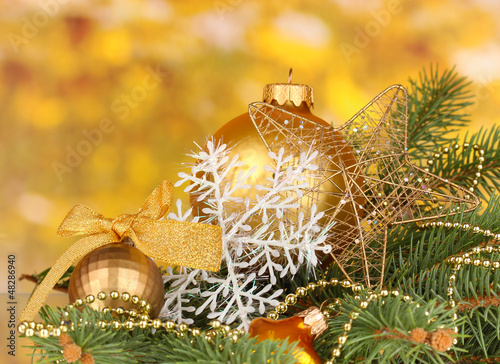 Photo: Christmas decoration on yellow background Christmas decoration on yellow background