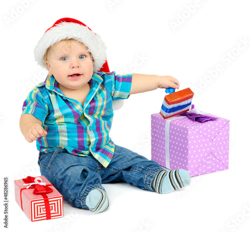Photo: Little boy with gift, isolated on white Little boy with gift, isolated on white