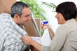 Couple installing furniture