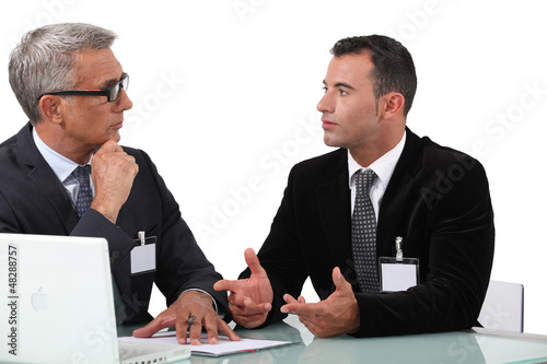 Photo: businessmen having a discussion businessmen having a discussion