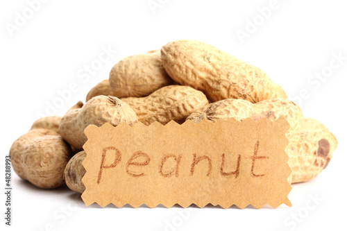 Photo: tasty peanuts, isolated on white tasty peanuts, isolated on white