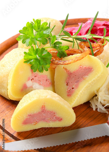 Photo: Meat stuffed potato dumplings with shredded cabbage Meat stuffed potato dumplings with shredded cabbage