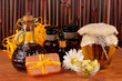 ingredients for soap making on brown background