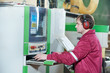 Photo: Portrait of carpentry worker with CNC machine Portrait of carpentry worker with CNC machine