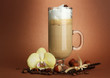 Fragrant coffee latte in glass cup with spices,