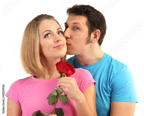 Photo: Loving couple with rose isolated on white Loving couple with rose isolated on white