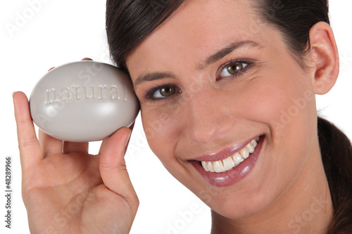 Photo: Woman holding large pebble Woman holding large pebble