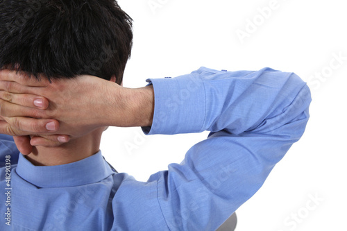 Photo: Man with his hands clasped behind his neck Man with his hands clasped behind his neck