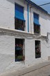 Plastered wall of Mediterranean house with four windows