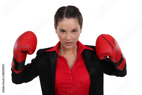 Photo: Businesswoman in boxing gloves Businesswoman in boxing gloves