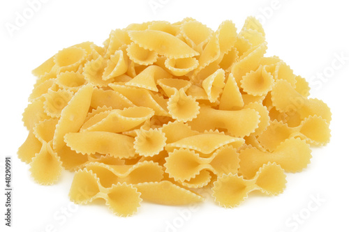 Photo: Heap of bow tie pasta isolated on white background Heap of bow tie pasta isolated on white background