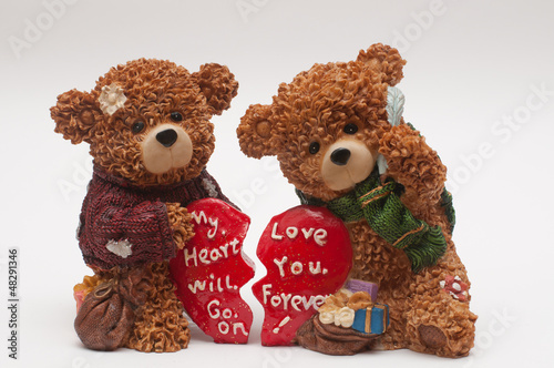 Photo: bears with broken hearts isolated on white bears with broken hearts isolated on white