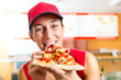 Woman eating a slice of pizza