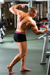 Bodybuilder posing in Gym