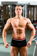 Bodybuilder posing in Gym