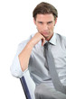 Photo: Young businessman leaning on his chair Young businessman leaning on his chair