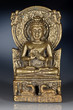 Bronze figurine of sitting Buddha on dark  blue background