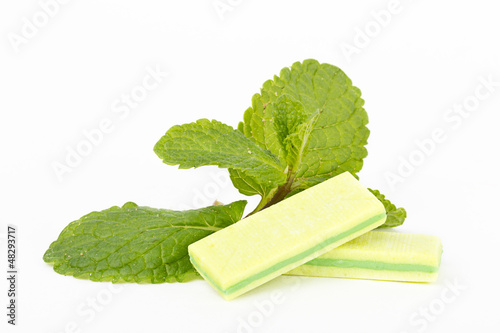 Photo: Bubble gum with mint on white background Bubble gum with mint on white background