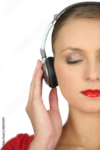 Photo: Woman enthralled by her music Woman enthralled by her music