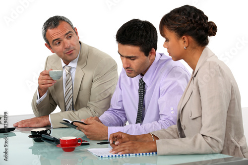 Photo: Three people sat on interview panel Three people sat on interview panel