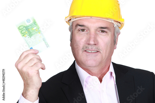 Photo: Architect holding bank note Architect holding bank note