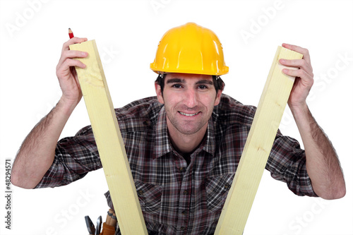 Photo: Man between two planks of wood Man between two planks of wood