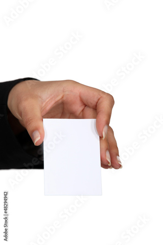 Photo: woman holding a business card woman holding a business card