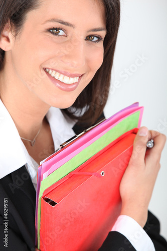 Photo: woman holding files woman holding files