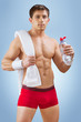 a handsome young sportsman with water