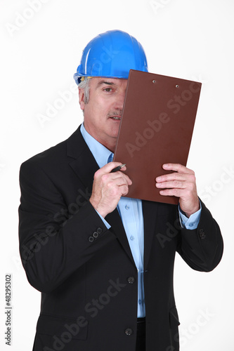 Photo: Man with portfolios covering hir eye Man with portfolios covering hir eye