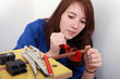 red-haired girl working as plumber