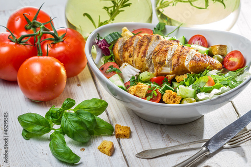 Photo: Caesar Salad with chicken and fresh ingredients Caesar Salad with chicken and fresh ingredients