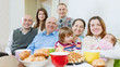 happy  family or group of friends over tea