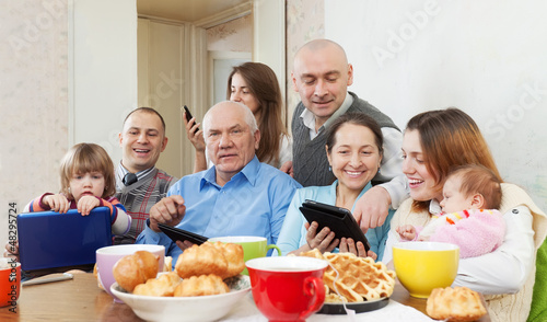 Photo: Happy family with electronic devices Happy family with electronic devices