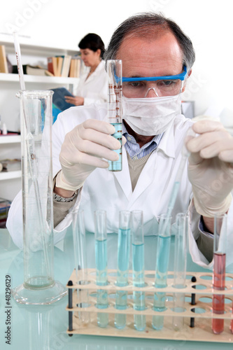 Photo: Chemist making experiments Chemist making experiments