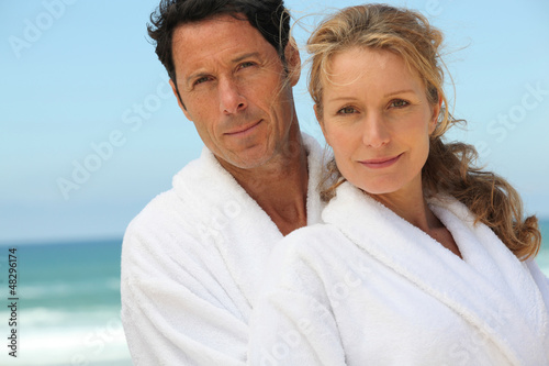 Photo: Middle-aged couple in bathrobe Middle-aged couple in bathrobe
