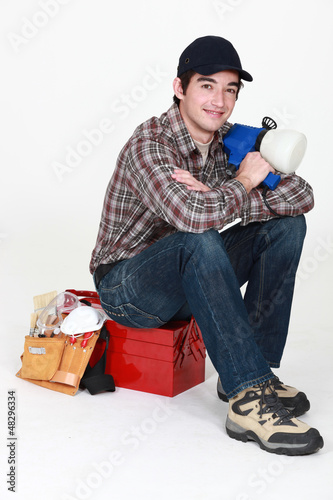 Photo: Tradesman posing for the camera with his tools Tradesman posing for the camera with his tools