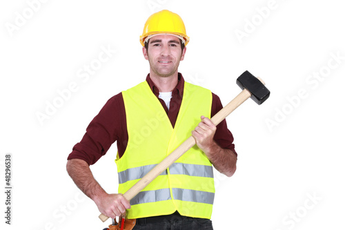 Photo: Labourer holding a mallet Labourer holding a mallet