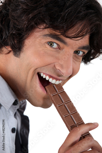 Photo: Man with a bar of chocolate Man with a bar of chocolate