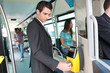 Photo: Businessman validating travel card Businessman validating travel card