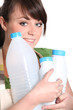 Woman with empty plastic bottles