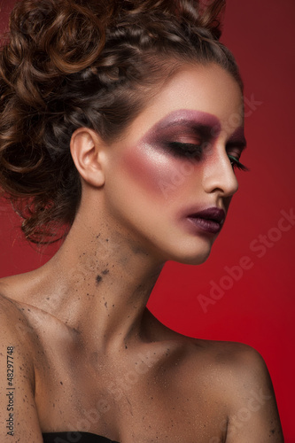 Photo: Woman with creative bright makeup Woman with creative bright makeup
