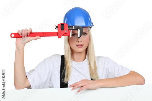 Photo: Craftswoman with wrench Craftswoman with wrench