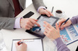 business people' hands with a Liquid-Crystal Display