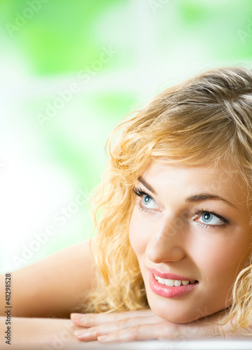 Photo: Smiling young beautiful woman, indoors Smiling young beautiful woman, indoors