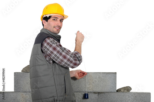 Photo: mason building a wall mason building a wall