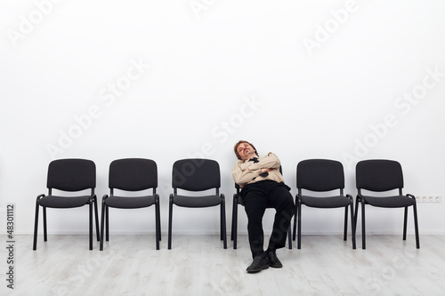 Photo: Tired businessman waiting Tired businessman waiting