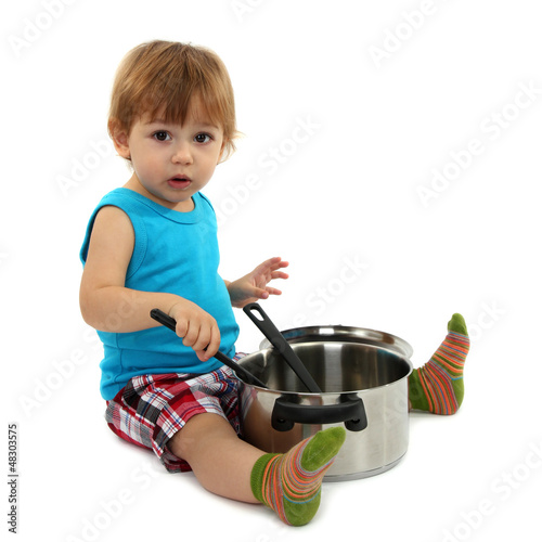 Photo: cute little boy with kitchen accessories, isolated on white cute little boy with kitchen accessories, isolated on white