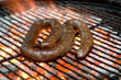 Photo: Tradtional South African braai barbecue borewors sausage on fire Tradtional South African braai barbecue borewors sausage on fire