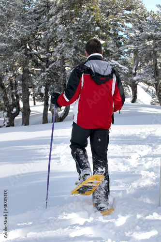 Photo: Man walking through the snow Man walking through the snow